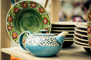 original painting on clay plates and a teapot