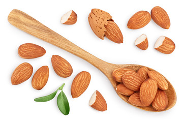 Almonds nuts with leaves in wooden spoon isolated on white background with clipping path and full depth of field. Top view. Flat lay.