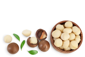 macadamia nuts in wooden bowl isolated on white background with clipping path and full depth of field. Top view with copy space for your text