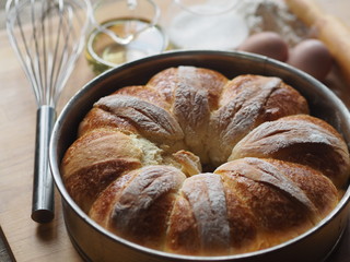 Festive Easter, Christmas or everyday bread rolls on a wooden rustic ancient table.Homemade cake. Side view.