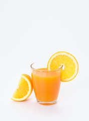 Glass of orange juice on white background