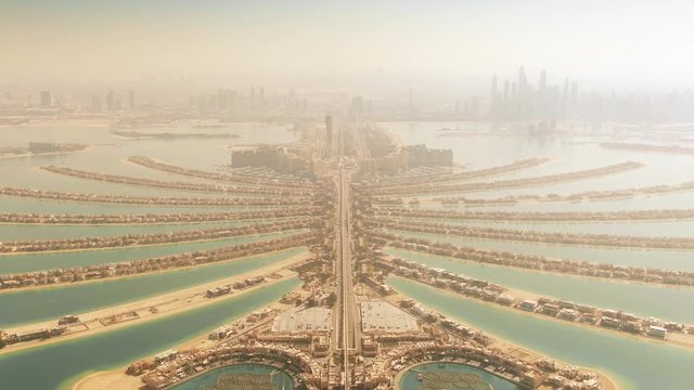 High altitude aerial view of the Palm Jumeirah island and Dubai's skyline. UAE