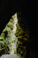 View through a cave of the hiking trail in Saxon Switzerland