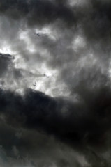 Clouds in the sky. The sun shines through the clouds.