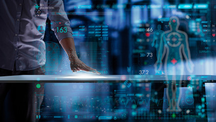 Smart Medical Doctor hand with stethoscope working on modern table computer UI and AR computer.