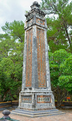 Fototapeta na wymiar Obelisk at the Stele Pavilion. Tomb of Tu Duc in Hue, Vietnam