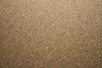 Chipboard plate. Wooden board made of sawdust. Top view.