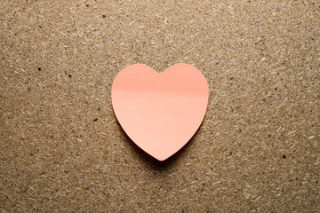 Obraz premium Pink Paper heart on chipboard