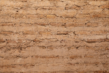 Traditional brown mud brick wall 