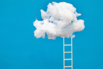 ladder leading up to a puffy cotton cloud on a blue background.