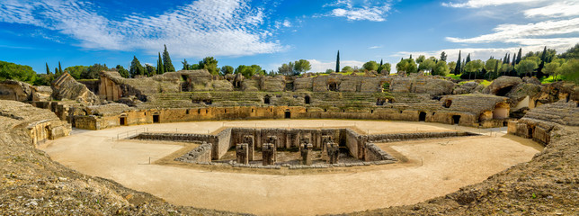Panoramic view of the Roman amphitheater in the ancient town of Italica in Santiponce, Spain.