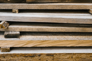 old wooden planks are stacked one on top of the other. wooden background for design