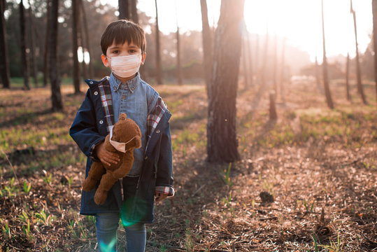 Kid and teddy bear using air masks