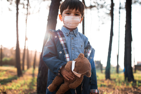 Kid and teddy bear using air masks