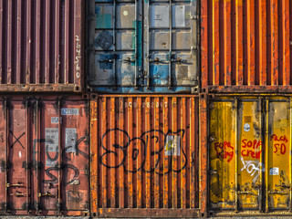stack of multicoloured shipping containers