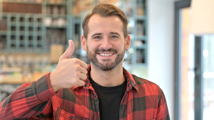Portrait of Thumbs up by Approving Beard Young Man