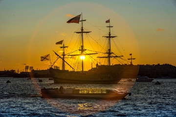 old sailing ship at sunset