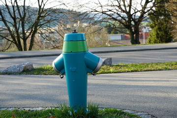 Fire hydrant or water hydrant on the public ground in village Urdorf in Switzerland painted in...