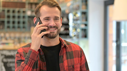 Beard Young Man Talking on Phone