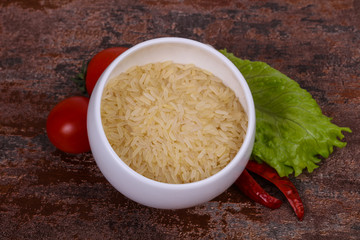 Raw uncooked rice in the bowl