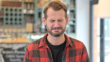 Portrait of Upset Beard Young Man Crying at Camera