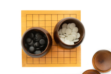 weiqi broad game, baduk, igo - play with black and white stone