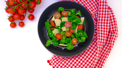 fresh salad with tomatoes and parmesan grain
