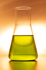 Retort with yellow chemical reagent