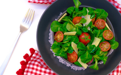 fresh salad with tomatoes and parmesan grain