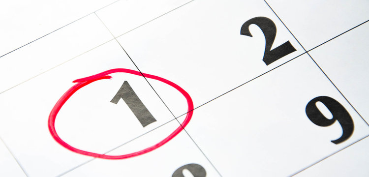 The first number in the calendar is circled in red in macro. Calendar for plans, notes, meetings. Business calendar.