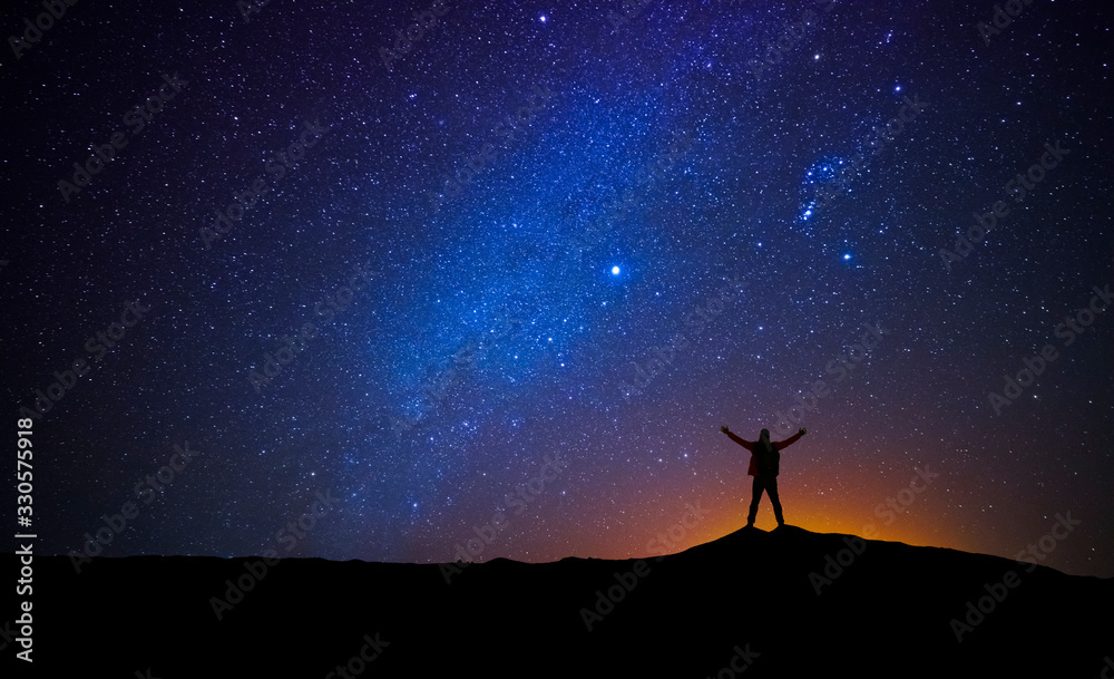 Canvas Prints man in front of the universe with his arms raised