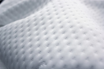 Natural jacquard mattress fabric with a pattern. Close-up photos.