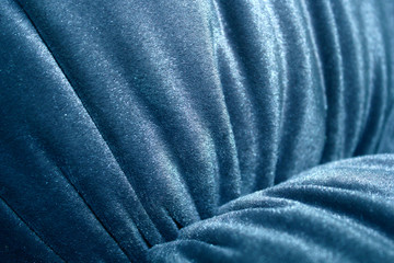 Detail of the chair armrest . Pleats on the velour upholstery. Background for a furniture workshop. Close-up photos.