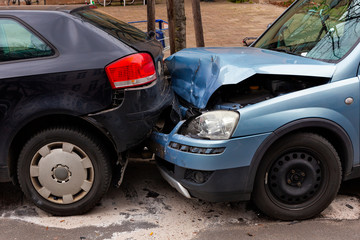 Two cars with metal damage after a rear-end collision