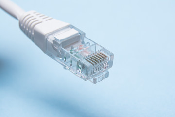 White network connector isolated on a blue background.