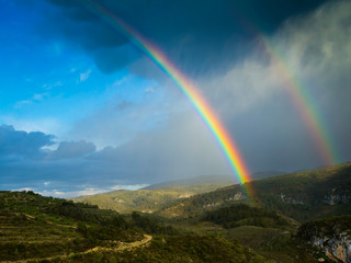 View of the mountains and a double rainbow.