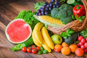 Composition with assorted raw organic fresh vegetables. Assortment of fruits and vegetable. Healthy raw detox food diet concept.