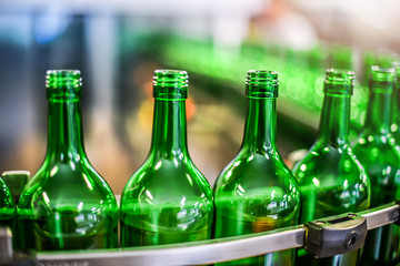 Bottling and conveyor line or belt at winery factory, Wine bottles filling production.