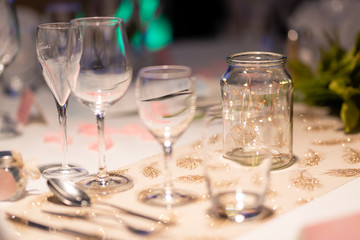 Table set with glasses, wine, alcohol and champagne for a celebration or a wedding