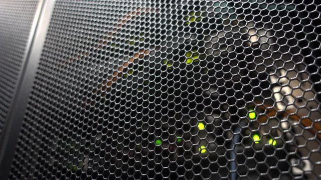 Door of a server rack close-up. Blurred Blink Background. Honeycombs