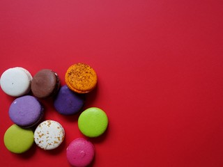 layout of colored macaroons on a solid color background