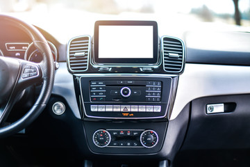 Interior view of car, Luxury car steering wheel and clean dashboard with display or monitor screen.