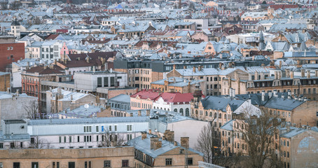 Fototapeta premium Panoramic, aerial view over Riga city. Scenic view over iconic church towers, old town and infrastructure.