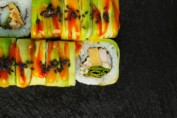Japanese food: Set of salmon sushi and rolls with salmon and eel