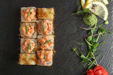 Japanese food: Set of salmon sushi and rolls with salmon and eel