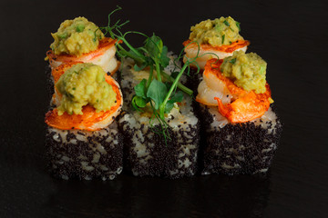 Japanese food: Set of salmon sushi and rolls with salmon and eel