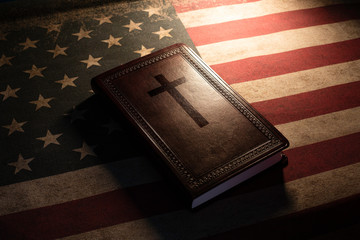 Holy Bible on a vintage american flag