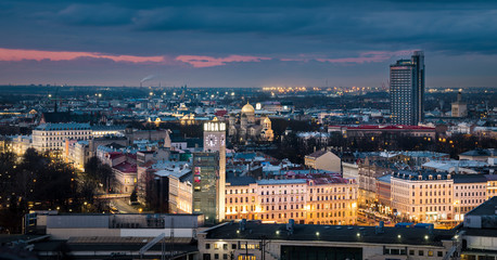 Panoramic, aerial view over Riga city. Scenic view over iconic church towers, old town and infrastructure.
