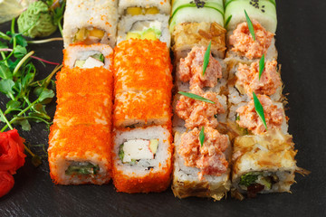 Japanese food: Set of salmon sushi and rolls with salmon and eel