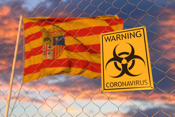 Coronavirus warning sign on the fence against waving flag of Aragon, an autonomous community in Spain. Quarantine related 3D rendering